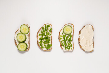 Sandwiches with cream cheese, cucumbers and green onions. Healthy eating concept