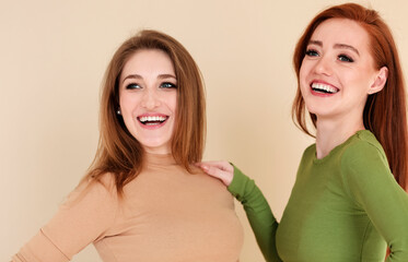 Cheerful young women looking away