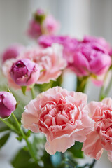 Bouquet of lilac roses and pink carnations. Close up