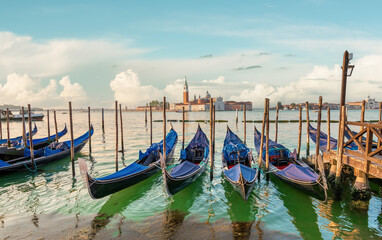 Gondolas and San Giorgio in Venice - 714702439