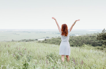 Fototapeta premium Young woman resting in countryside