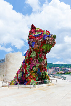 BILBAO, SPAIN - JUNE 14, 2014: Puppy by Jeff Koons in front of Guggenheim Museum in Bilbao