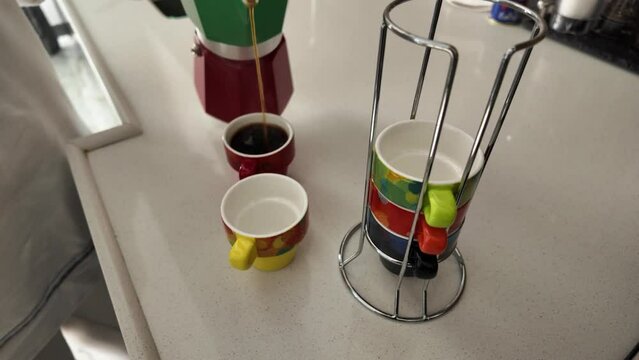 Pouring, Cooked coffee, Coffee pot, Multi-colored mugs, Slow motion, Kitchen bench, Beverage, Aromatic, Coffee preparation, Domestic scene, Slow-motion video, Kitchenware, Brewing process, Pouring cof
