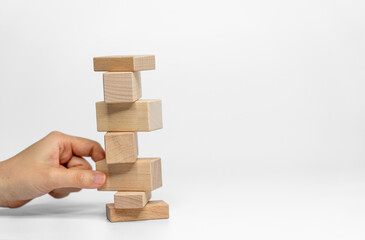 building wood blocks on white background; business or creative concept