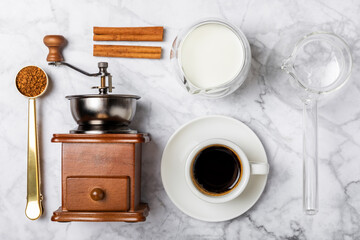 Ingredients for making coffee. Moka pot, turkish coffee pots (cezve), coffee grinder with coffee...
