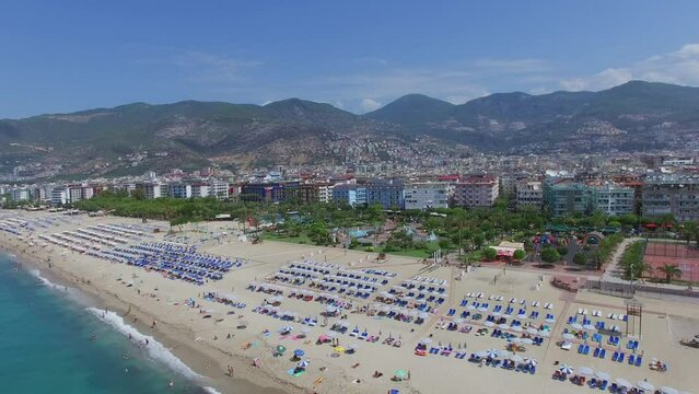 Cityscape with sand beach at summer sunny day. Aerial view