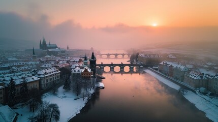 Naklejka premium Charles bridghe with beautiful historical buildings at sunrise in winter in Prague city in Czech Republic in Europe.