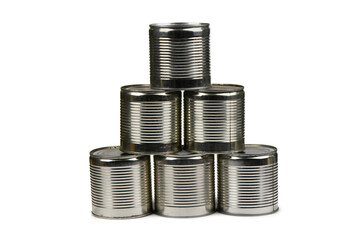 Open metal tin cans placed in a pyramid isolated on white background.