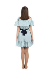 Young beautiful girl in a dress with polka dots on a white background.