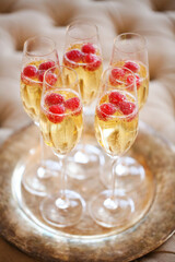 Champagne glasses on silver tray. Party concept