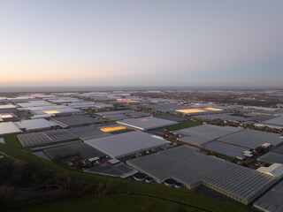 Greenhouses in the Netherlands at dusk. Production of food and vegetables.