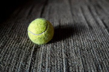 Tennis ball on a textile background. 