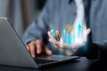 Businessman show economic growth graph in percentage for investment growth. business financial investment, business growth, income, marketing and profit , Interest rate and dividend concept .