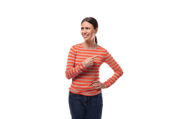 pretty young brunette woman dressed in tight orange sweater draws attention