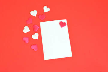 writing valentine card copy space white and red hearts