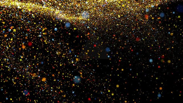 Falling golden particles on a black background
