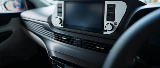 Hand operating switch on the car, car interior button, Interior of the car with cruise control...