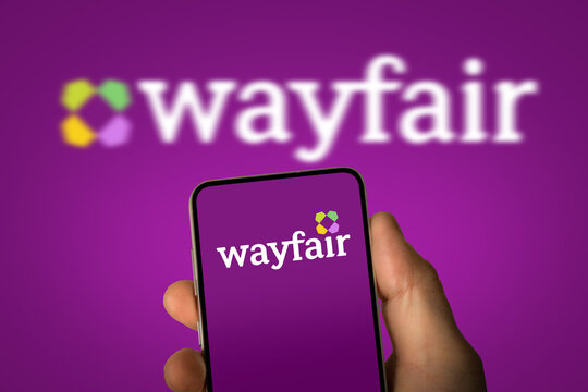 Wayfair for furniture and home goods - company logo displayed on smartphone