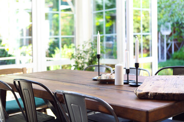 Candles and snacks on table on terrace
