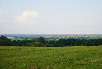 Summer, sunny, warm, light landscape overlooking the horizon