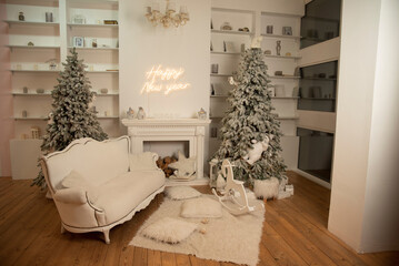 Christmas tree with gifts in a room with a fireplace and sofa