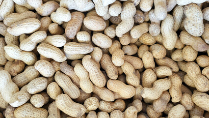 Background, texture of unpeeled peanuts