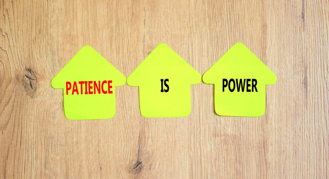 Patience is power symbol. Concept words Patience is power on beautiful yellow paper houses. Beautiful wooden table wooden background. Business and patience is power concept. Copy space.