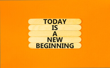 Today is a new beginning symbol. Concept words Today is a new beginning on wooden stick. Beautiful...