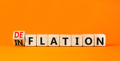 Deflation or inflation symbol. Concept word Deflation Inflation on beautiful wooden cubes. Beautiful orange table orange background. Business deflation inflation concept. Copy space