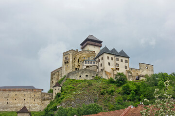 Fototapeta na wymiar The ancient Trencin Castle from the 11th century in Slovakia. Landscape with a medieval castle on top of a mountain.