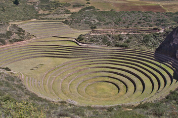 Maras, Peru – May 27 2018: Located in the Sacred Valley, Peru, the Incan ruins of Moray are composed of three groups of circular terraces believed to be be used for agricultural experimentation. 
