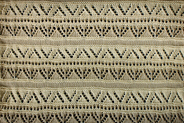 white background knitted openwork material with close-up pattern - obrazy, fototapety, plakaty