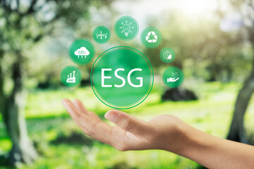 Social investment business concept. ESG and environmental governance, human hand holding green ESG...