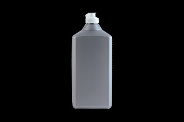 grey plastic bottle on a dark background.