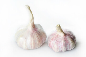 whole garlic heads on a white