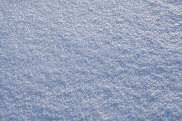 Close-up of fresh snow on a flat surface. Winter nature landscape