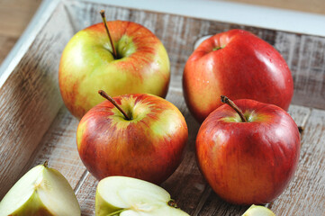 ripe apples in a wooden box
