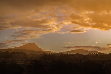 the Sainte Victoire mountain in the light of a cloudy winter morning
