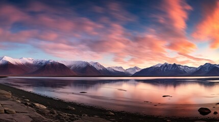 Obraz premium A panoramic view of the beautiful evening scenery of Bachalp Lake, with mountains dotted with snow. 