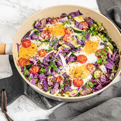 shakshuka with red cabbage, zucchini and celery