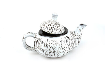 White ceramic teapot insulated on a white background.