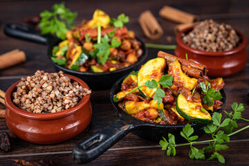 tagine with squash and dates with buckwheat in a pan