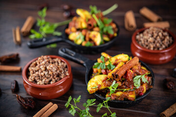 tagine with squash and dates with buckwheat in a pan