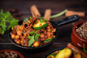 tagine with squash and dates with buckwheat in a pan