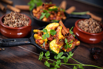 tagine with squash and dates with buckwheat in a pan