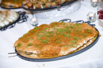 Knafeh or Kataif, a traditional Middle East dessert with pistachio powder on top