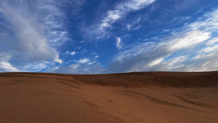 Detail view of the sand dunes of Patara, Turkey and a view of the cloudy sky.