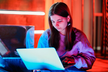 Teen girl watching video on laptop