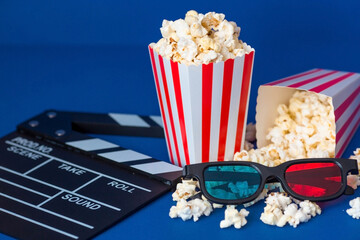 A banner for the film industry. A romantic movie date. A movie camera, 3D glasses, popcorn in...