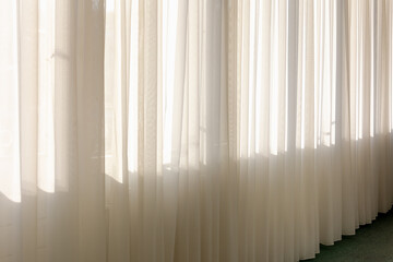 Light and see through concept, Classic white sheer curtains hanging by the window in the corridor...